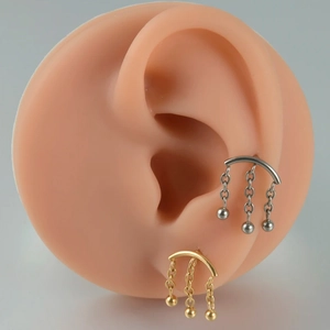 G23 Titanium chain tassel earrings in gold and silver finish shown on ear model