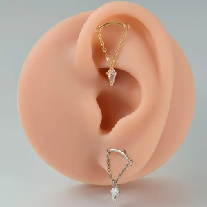 G23 titanium chain earrings with marquise zircon charms on a silicone ear model
