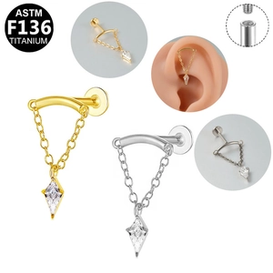 Detail of G23 titanium labret stud with marquise zircon and chain hanging on silicone ear