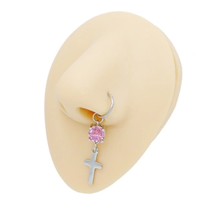 Detail of silver stainless steel septum ring with pink gemstone and cross pendant charm