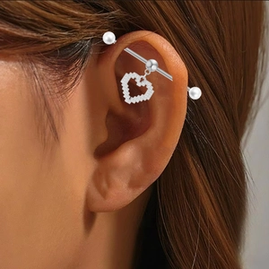 Industrial barbell earring with pixel heart pendant and pearls on model