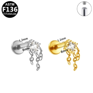 Macro view of G23 titanium labret studs with square zircon and dangling tassel chains