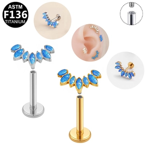 Detail of G23 titanium internally threaded labret with marquise fan opal studs