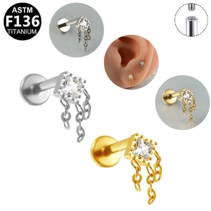Detail of G23 titanium labret with square zircon and dangling chain tassel fringe
