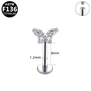 Detailed view of F136 titanium butterfly labret stud with 1.2mm gauge and 8mm length