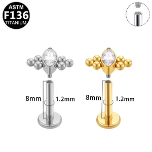 Macro detail of F136 titanium butterfly labret stud with marquise zirconia and thread