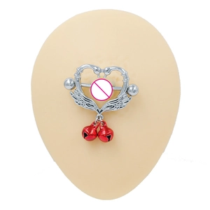 Detail of silver nipple ring featuring swan heart design and red bell pendants on a model