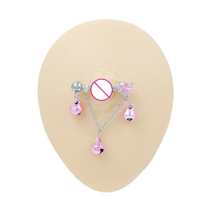 Titanium nipple ring featuring pink heart zircon and dangling bells on flesh-toned model