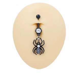 Gothic black spider belly button ring with sparkling zircon stones on a model