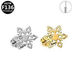 Detail view of F136 titanium snowflake studs in gold and silver with internal threading