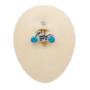 Silver motorcycle navel piercing with blue crystals shown on skin model