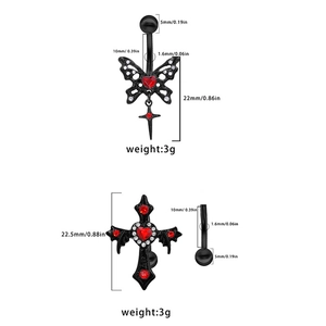 Detailed specs of gothic black belly rings with red zircon and cross pendants