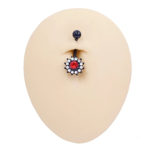 Detail of black navel ring with red center stone and white rhinestones on silicone model