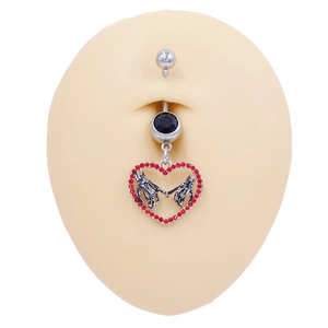 Piercing ombelico gotico con ciondolo a cuore mani di scheletro e gemme rosse