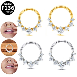 G23 Titanium septum clicker ring featuring five square zircons in gold and silver