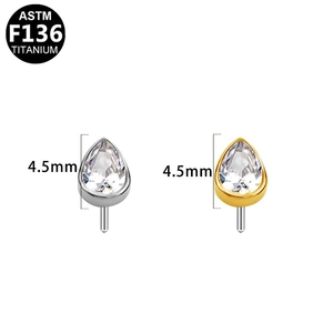 Macro detail of 4.5mm ASTM F136 titanium pear-cut zircon threadless piercing tops