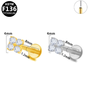 Detailed macro view of F136 titanium flower stud earrings with zircon inlays and screw posts