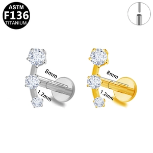 G23 titanium labret piercing with three-stone curved zircon cluster design
