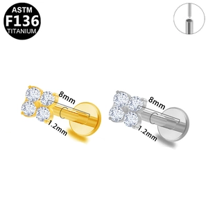 Detail of G23 titanium labret stud featuring 4-petal flower cubic zirconia with size specs