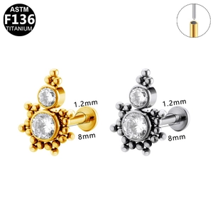 Macro detail of F136 titanium piercing stud with zircon inlay and 1.2x8mm dimensions