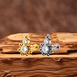 Titanium G23 sunburst labret earrings with zircon insets in gold and silver finish