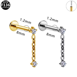 Detail of ASTM F136 titanium labret earrings with chain pendant and round zircon stones