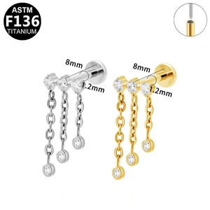 Detailed macro view of F136 titanium earring with three hanging chains and internal threads