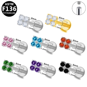 Close-up of G23 titanium internally threaded labret studs with multi-color zircon