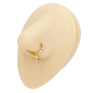 Detail showing a golden heart moon nose ring with white zircons on a silicone nose model