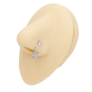 Detail of silver stainless steel nose ring with a sparkling rhinestone star pendant