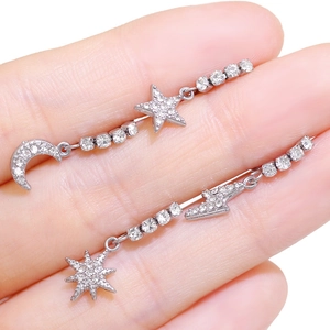 Silver celestial earrings with moon and star pendants featuring sparkling zircon stones
