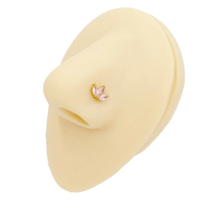 Detail of gold butterfly nose stud with pink marquise zircon on a silicone model