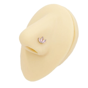 Macro shot of pink marquise zircon butterfly nose stud on silicone nose model