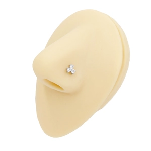 Detailed view of stainless steel butterfly nose stud with three clear stones on a silicone model