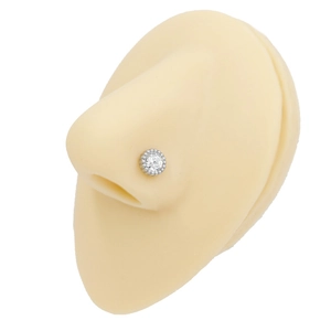 Detail view of butterfly piercing stud with zircon on silicone nose model display