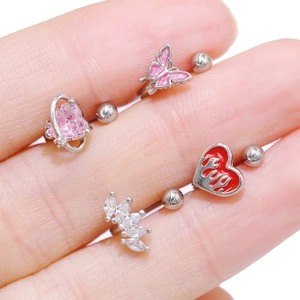 Macro shot showing titanium steel butterfly and zircon studs for ear or nose piercing