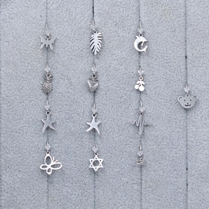 Polished stainless steel nose rings set with zircon bear and butterfly pendants