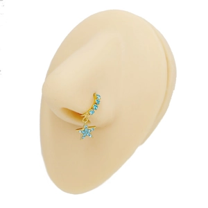 Detailed view of a gold-plated nose ring with blue rhinestones and a star pendant