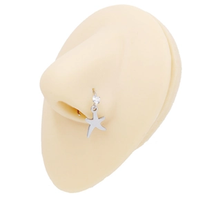 Detail of stainless steel nose ring with star pendant and zircon on a display model