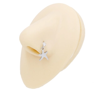 Detail of silver starfish nose stud with zircon stone on realistic piercing model