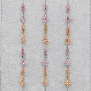 Set di 12 orecchini in acciaio inossidabile con zirconi rosa in finitura oro e argento
