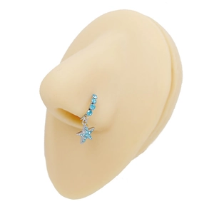 Detail of silver lightning nose ring with blue rhinestones and star charm on model