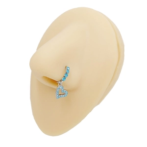 Close-up of heart-shaped stainless steel nose ring with blue crystals on silicone model