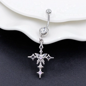 Macro shot of silver cross navel ring with purple butterfly wings and clear zircon stone