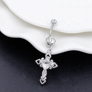Detail showing cross pendant with heart zircon and polished steel belly button ring
