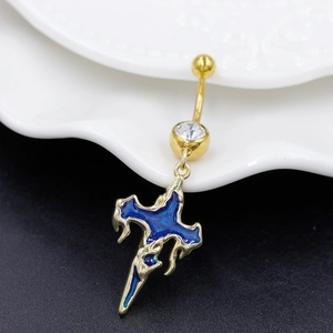 Detailed view of golden cross belly ring with blue enamel and sparkling rhinestone accent