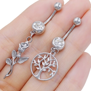 Polished stainless steel navel rings featuring rose flower and tree of life designs