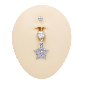 Detail of silver steel belly ring with star pendant featuring sun and moon engraving