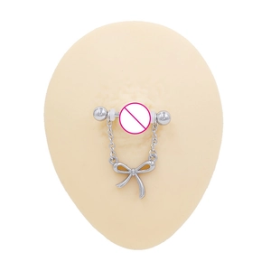 Silver barbell nipple ring with delicate chain and bow pendant on silicone model