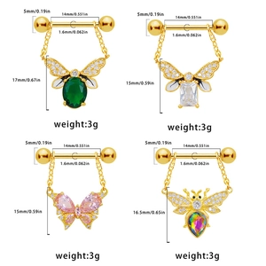 Detailed view of 14G butterfly and bee nipple rings with zircon and colorful gemstones